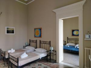 Posteľ alebo postele v izbe v ubytovaní Palazzo Castellano