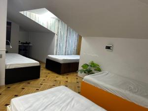 Ένα ή περισσότερα κρεβάτια σε δωμάτιο στο Porta Hostel