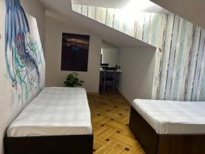 Ένα ή περισσότερα κρεβάτια σε δωμάτιο στο Porta Hostel