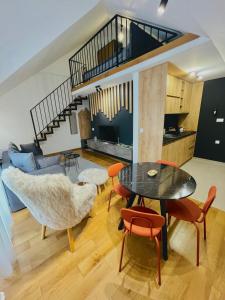 Η κουζίνα ή μικρή κουζίνα στο Alpine Breza Apartments