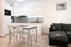 Kuchyňa alebo kuchynka v ubytovaní Apartamenty Bursztynowe