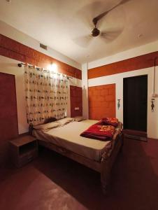 a bedroom with a large bed with a ceiling at Amberleaf Estate 4BHK Homestay Coorg by Homeyhuts in Virajpet