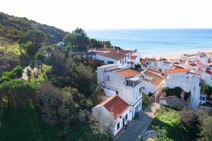an aerial view of a village and the beach at Chalet du Solei- V022 in Salema