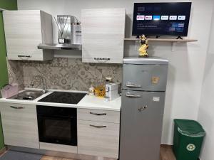 A kitchen or kitchenette at Holiday apartament