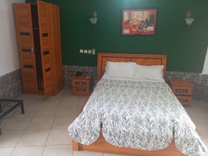 Ένα ή περισσότερα κρεβάτια σε δωμάτιο στο Résidence Roberta