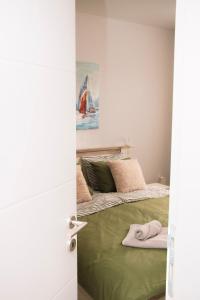 Postel nebo postele na pokoji v ubytování Blue Apartment