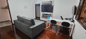 TV in/ali zabaviščno središče v nastanitvi CAXU HOSTEL