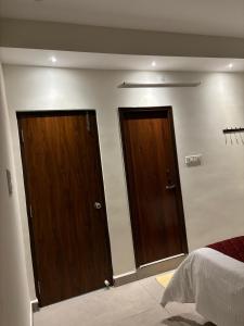Postel nebo postele na pokoji v ubytování PS Elite Homestay