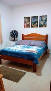 Cama ou camas em um quarto em Chalés e suítes lima