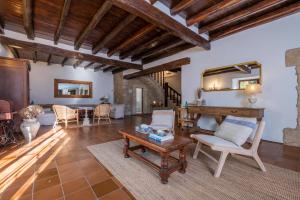 an open living room with a table and chairs at CC-1 Casa Mar y Viñas in Begur