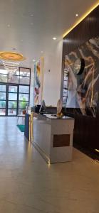 a lobby with a reception desk in a building at BlueNeck Ayodhya-Near ShriRam Mandir in Ayodhya