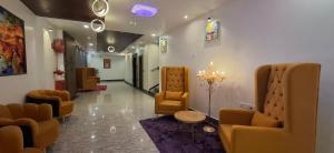 a waiting room with chairs and a hair salon at BlueNeck Ayodhya-Near ShriRam Mandir in Ayodhya