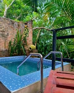 a small swimming pool with a stairway next to at Airport Villa Kamatha -Foreign booking only in Katunayake