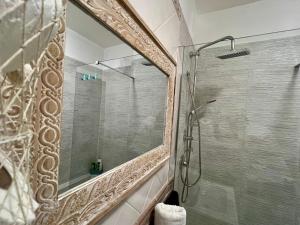 a bathroom with a shower with a mirror at Casa Yasmine in Santa Flavia +48 photos