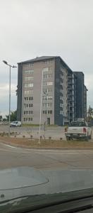 a car parked in front of a large building at Departamentos JM osorno in Osorno