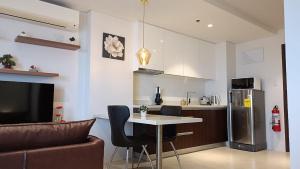 Kuchyň nebo kuchyňský kout v ubytování Lapu-Lapu Condo Tambuli Seaside Living