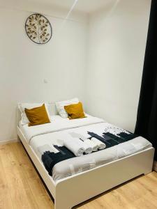 Postel nebo postele na pokoji v ubytování Apparts de standing Bruxelles Brady Muandaz + 5 fotografií