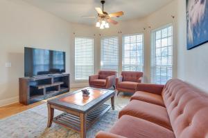 a living room with a couch and a tv at Serene 50-Acre Nature Retreat Near Melissa and Anna in Blue Ridge