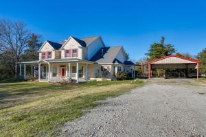 a house with a red roof and a driveway at Serene 50-Acre Nature Retreat Near Melissa and Anna in Blue Ridge