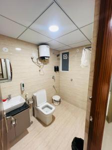 a bathroom with a toilet and a sink at The Sleepy Monkey in Jaipur
