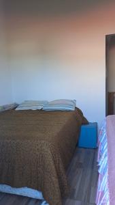 Ένα ή περισσότερα κρεβάτια σε δωμάτιο στο Casa de Temporada tranquila próxima das praias da Guarda do Embaú!Pinheiral! Sonho