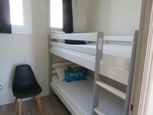 En eller flere senge i et værelse på Gite l'Embrun