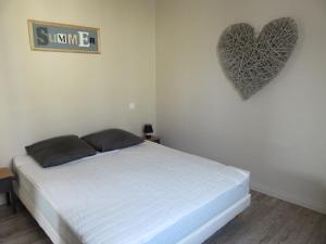 En eller flere senge i et værelse på Gite l'Embrun