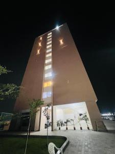 a tall building with stars on it at night at The Sleepy Monkey in Jaipur +7 photos