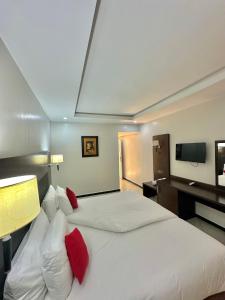 Postel nebo postele na pokoji v ubytování Hotel Oscar 1