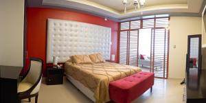 Postel nebo postele na pokoji v ubytování Plaza Sur Hotel & Suites
