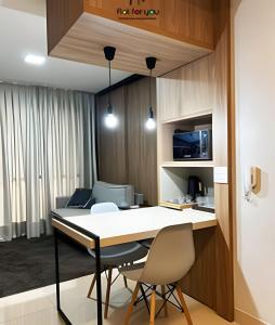 a dining room with a table and two chairs at #506# Apto de 1 quarto -Lounge 22 in Goiânia +21 photos
