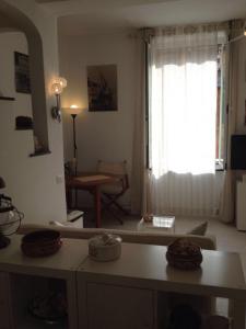 a living room with a table and a window at Civico 3 in Portofino