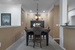 a dining room with a table and a chair at Seaside Comfort in Gulfport +29 photos
