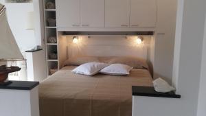 A bed or beds in a room at Civico 3