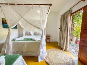 Postel nebo postele na pokoji v ubytování Pousada Casa Sítio Delícia do Quadrado + 86 fotografií