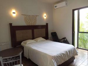 Postel nebo postele na pokoji v ubytování Hotel & Hostal 230