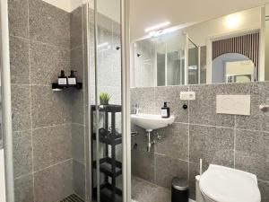 Ένα μπάνιο στο LTA Apartment München Süd No1 Fun & Games +25 φωτογραφίες