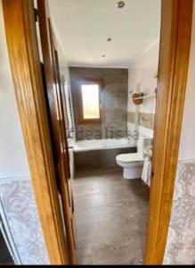 a bathroom with a tub and a toilet and a sink at Alojamientos Marte casa rural in Suances +25 photos