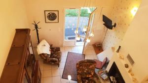a living room with two chairs and a television at Gîte de France à Bonnefond 3 épis - Gîte de France 6 personnes MAE-9754 in Bonnefond