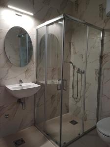 a bathroom with a shower and a sink at Forest River Sokobanja in Soko Banja