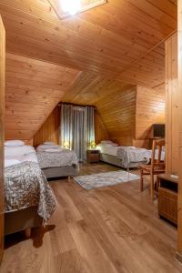 Postel nebo postele na pokoji v ubytování Apartamenty i Pokoje Teklarz & SPA