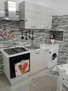 Η κουζίνα ή μικρή κουζίνα στο Casa vacanza Aurora +6 φωτογραφίες