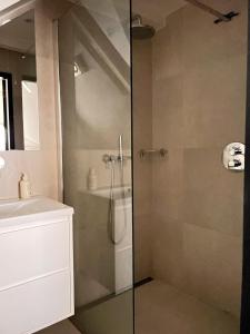 a bathroom with a shower and a sink at New V in Amsterdam +8 photos