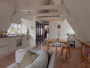a living room with a couch and a table at New V Luxury Apartment in Amsterdam
