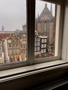 a view of a city from a window at New V in Amsterdam