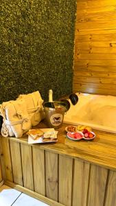 a table with plates of food and a sink at Pousada dos Canyons - chalé 01 in Praia Grande +10 photos