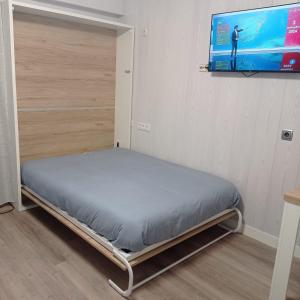 Ένα ή περισσότερα κρεβάτια σε δωμάτιο στο Estudio relajante en la Estación de Esquí la Pinilla
