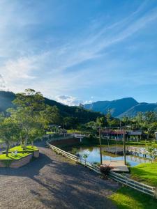a view of a river with mountains in the background at Pousada dos Canyons - chalé 01 in Praia Grande