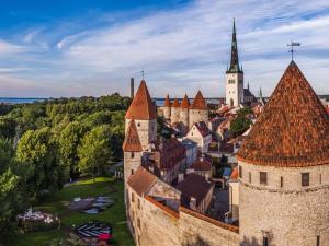 an aerial view of a town with a castle at Aquamarine Hotel - Lauluväljak in Tallinn