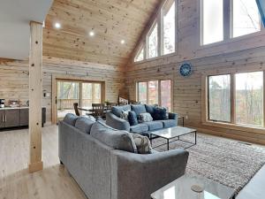 a living room with two couches and a table at Majestic Manor in McHenry +55 photos